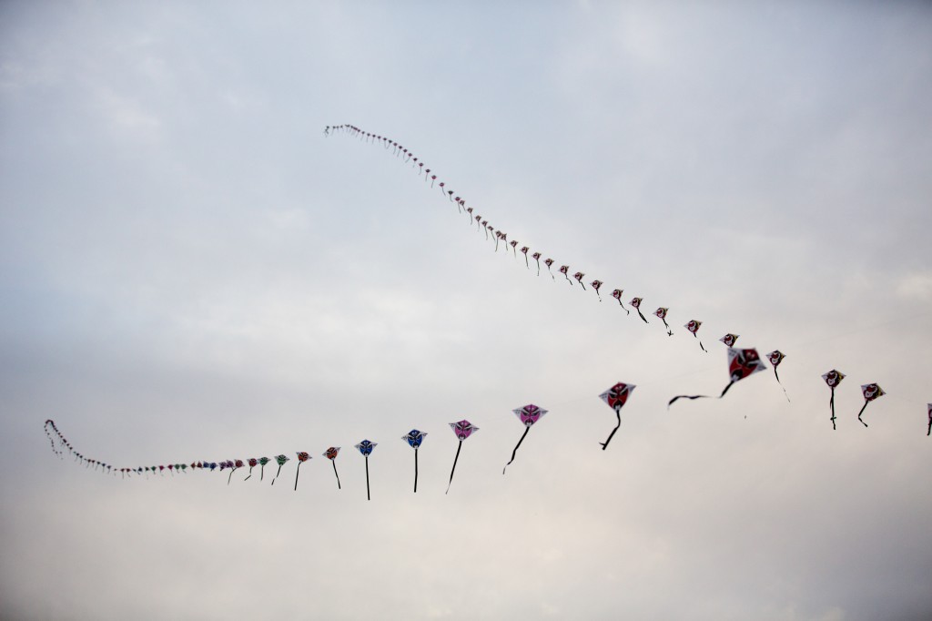 Stretching up into the Sky - A dozen people sold kites at the entrance to the touristy part of the Muslim Quarter. Their sales strategy: have their kites stretching twelve stories into the air.