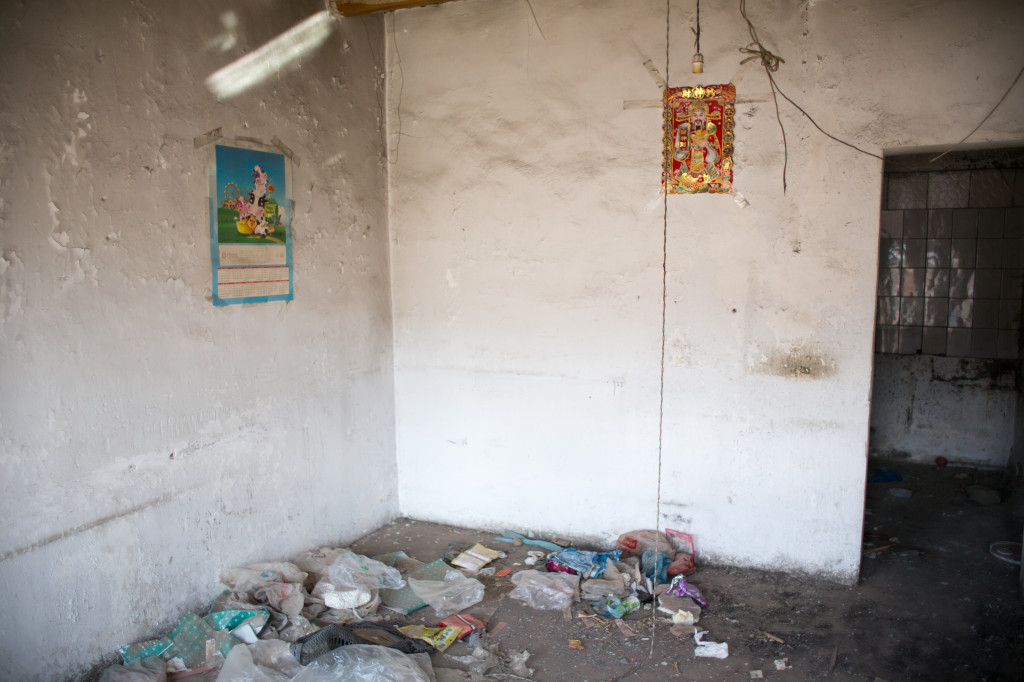 Inside the abandoned buildings filled with trash, loose bricks and feces
